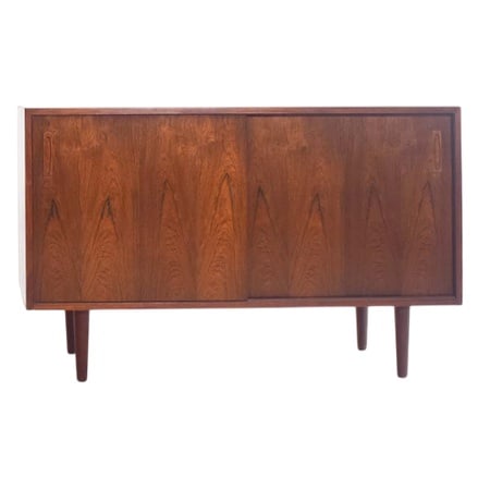 Rosewood Sideboard, Denmark, 1950s: Elegant sideboard, manufactured in Denmark in the 1950s, showcases the refined craftsmanship and timeless design of mid-century modern furniture. Crafted from luxurious rosewood, the sideboard