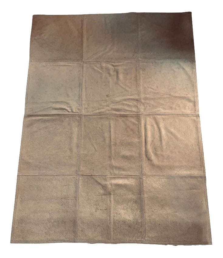 Postmodern Blond Leather Cow Rug, Italy, 1990s: This is an elegant rug made in leather, exactly cow leather. This rug has the short tan blond fur. It has been composed by twelve squares put together in perfect execution. It is not easy to find a