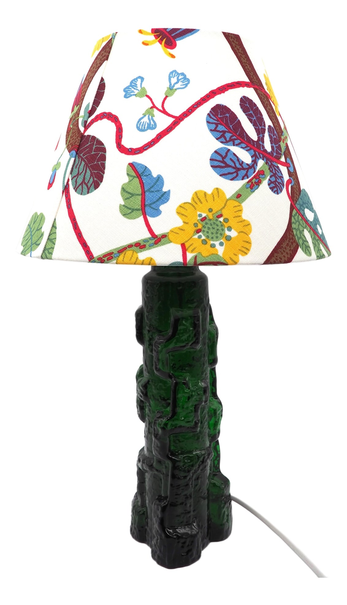 Glass Table Lamp by P. Kedelv for Reijmyre, 1960s: A wonderful lamp that shimmers in the light with its deep green color. A Table lamp evoking a rocky outcropping by Reijmyre Glasbruk. Crafted in emerald green tinted glass.A lamp that attracts