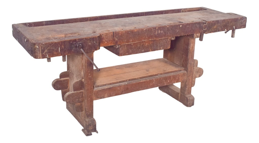 Portuguese Woodworkers Workbench, 1950s: Cabinetmaker's work bench. This solid wood carpenter's bench carries the history of the craft in every mark and wear visible on its surface. with its robust structure and long-used features, it is