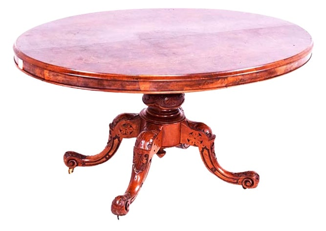 Antique Oval Walnut Dining Table, 1890s: Oval walnut table with tilt-top. Classically elegant and handmade, the top is oval and finished in polished walnut, emphasising the natural veins of the wood and giving it a warm, fine look. The