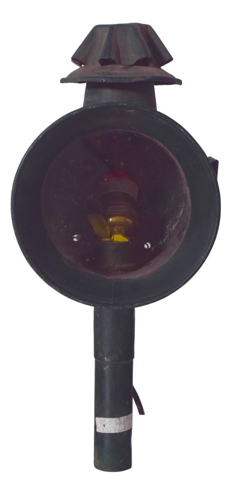 Antique Danish Metal Street Lantern, 1950: This antique Danish street lantern is a fine example of early urban lighting, combining functionality with simple, sturdy design. Made of metal with a cylindrical body and large front lens, it was