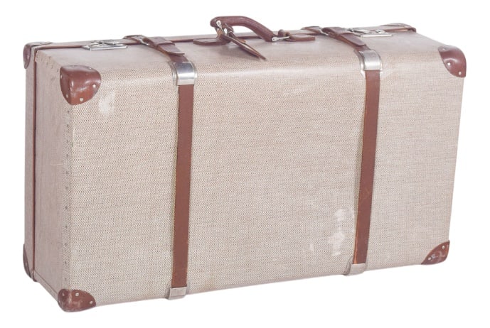 Mid-Century Modern Travelling Bag with Leather, 1950s: Travelling bag with leather. Rectangular in shape, with a rigid structure and generous proportions, it has a discreetly patterned beige acrylic fabric lining with visible signs of use.The corners are