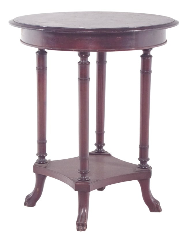 English Round Wood Coffee Table, 1890s: Round coffee table. with a smooth top, resting on four elegant turned legs connected to each other by a bottom rail in a square tray with curved corners. Each leg ends in a sculpted claw, suggesting t