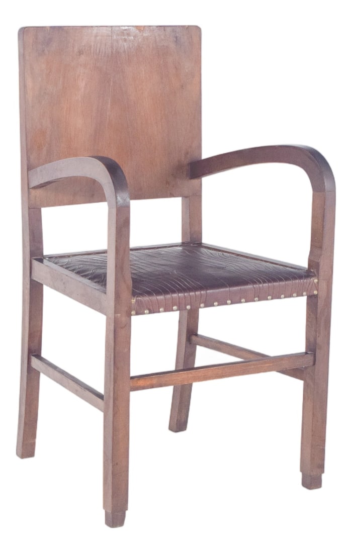 Antique Art Deco Chair, 1890s: Art Deco armchair. with curved arms and a straight back, representative of the Art Deco style, popular between the 1920s and 1940s. The seat is covered in dark brown leather, with bas-relief details t