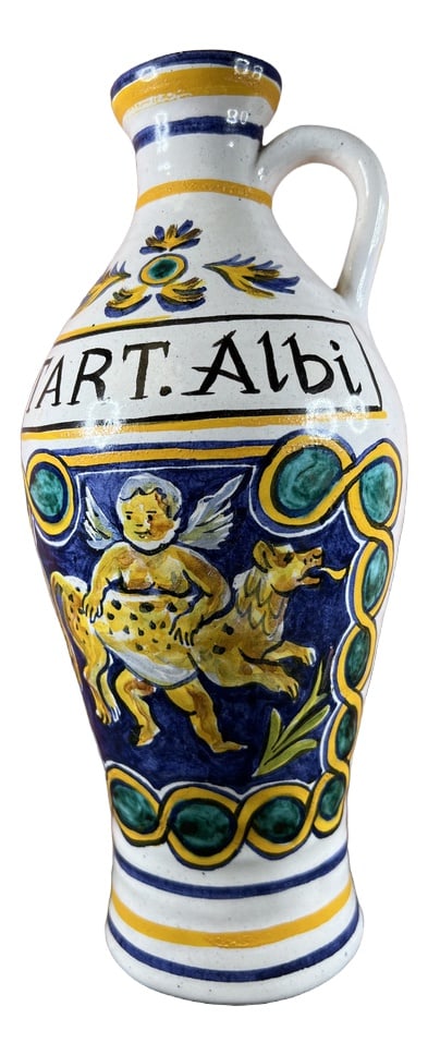 Vintage Pharmacy Jar or Vase: This old pharmacy jar or albarello in the shape of a bottle possesses fascinating features that make it a captivating piece of history. The marking "Tart. Albi" on the front adds a touch of