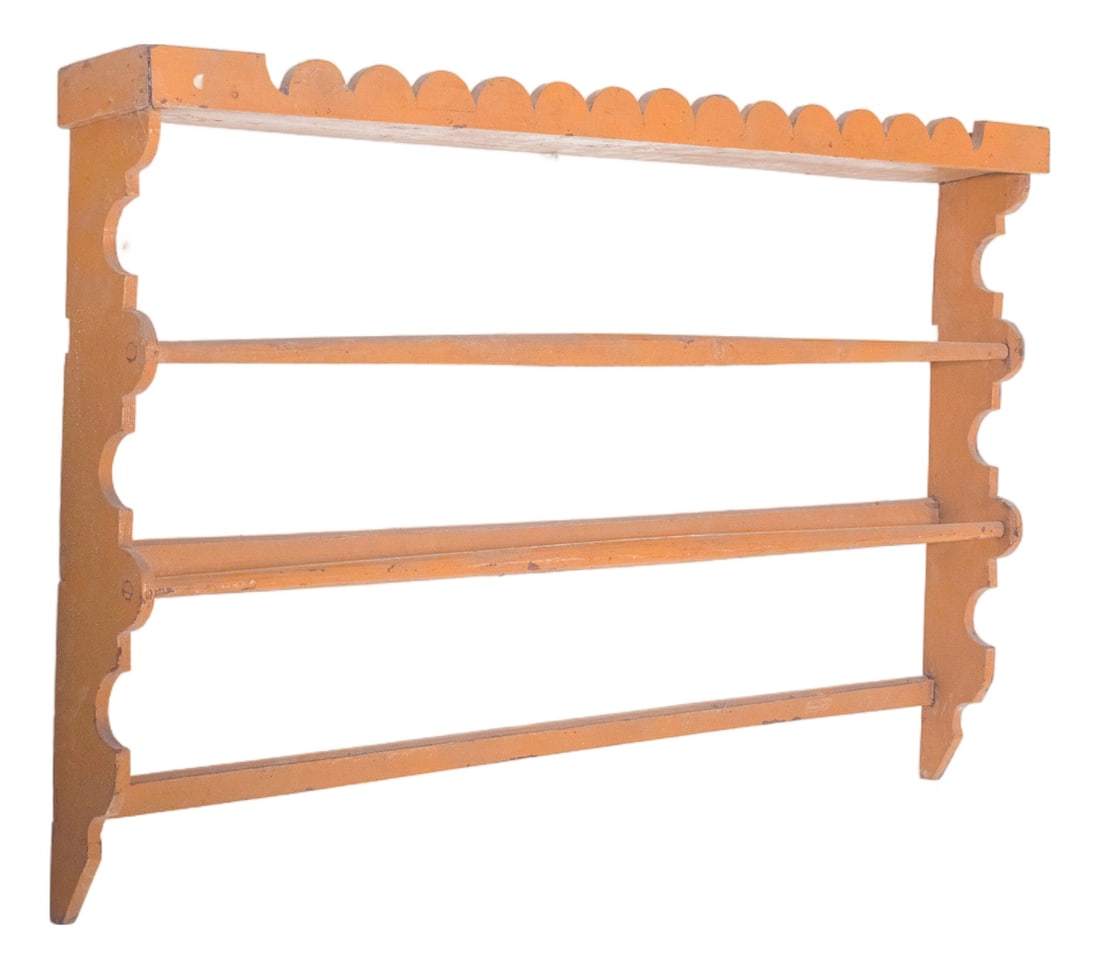 Rustic Portuguese Yellow Wooden Plate Rack, 1950: This rustic plate rack, crafted in wood and painted in a warm toasted yellow, radiates simplicity and charm. Its design is straightforward, with rounded cut-outs along the sides that add a touch of