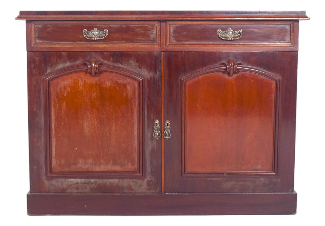 European English-Style Tall Sideboard: English-style tall sideboard. With two top drawers, each with a yellow metal handle. Below, two doors with recessed ogival arch panels and embossed centre decoration, also with decorated yellow metal