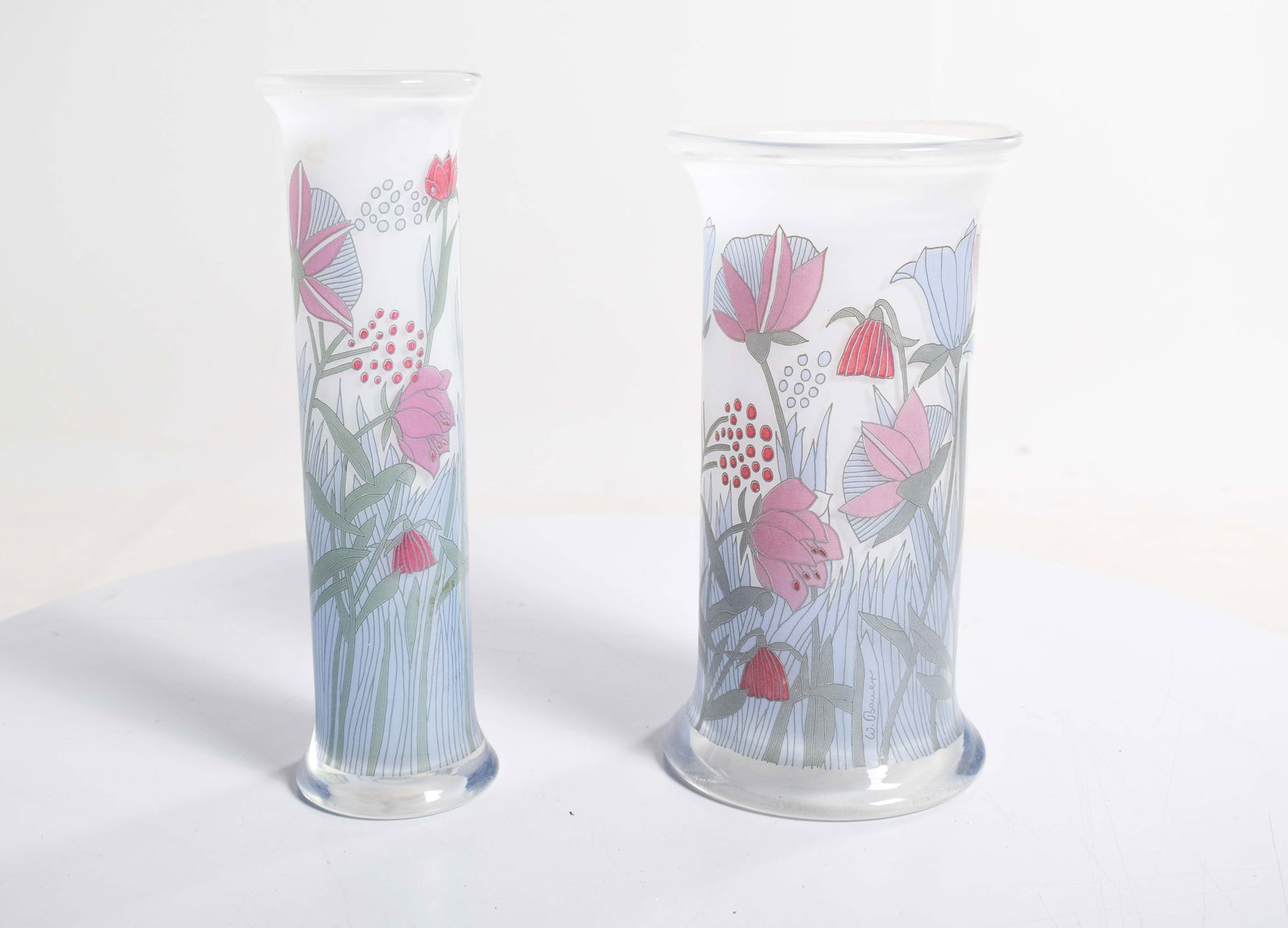 Painted Glass Jars by W. Bauer, Germany, 1930, Set of 2: Two painted glass jars. Deco style and signed W. Bauer. Elegant, decorated with flowers in shades of pink and red, with stems and foliage in shades of blue and grey. Country of Manufacture: Germany