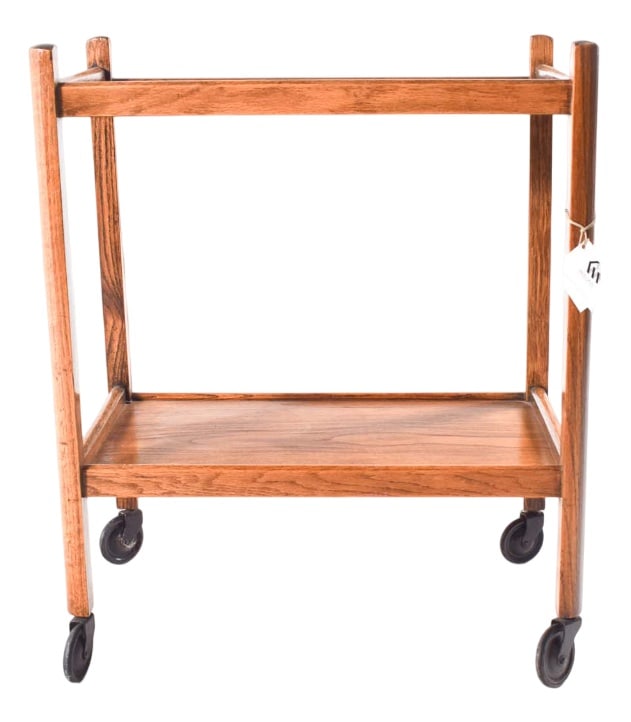 Vintage Danish Oak Tea Table, 1950s: This is a lovely vintage oak tea cart. Its wheels roll smoothly on the ground and have a simple style. This cart probably dates back to the 1950s and was made in Denmark. Country of Manufacture: