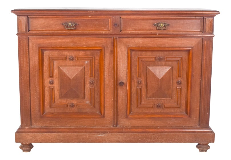 Antique European Oak Sideboard with Padded Doors: Oak sideboard with padded doors. A beautiful example of traditional joinery with a strong ornamental presence. The two front doors stand out due to the panels carved in relief with geometric