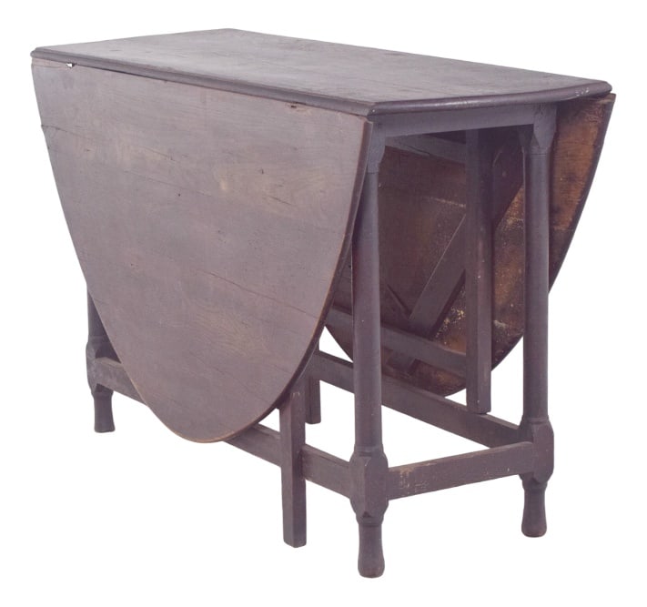 Vintage Portuguese Flip Flap Oval-Top Table, 1920s: Oval-top table. In dark wood, with an oval top divided into three sections, a fixed centre section and two movable side sections that fold down gracefully when not in use. The structure rests on