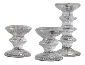 Glass Candlesticks by Sarpaneva for Iittala, Set of 3: Legend has it that the designer, the famous Timo Sarpaneva created it with... himself. One day, he decided to design a wine glass that would hold an entire bottle of this dry beverage. Thus the idea