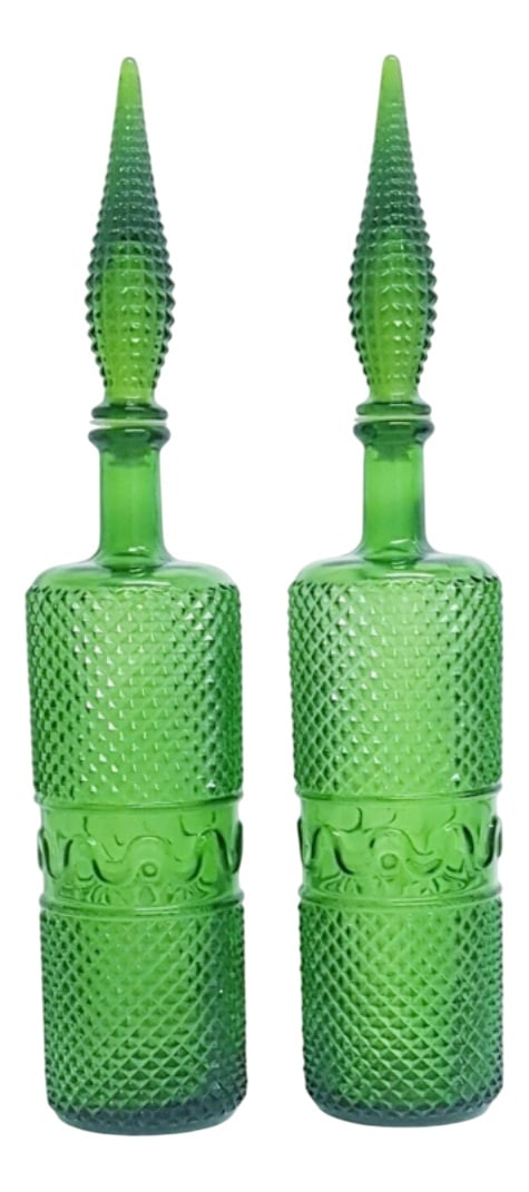 Mid-Century Italian Tall Carafes, Set of 2: A pair of large, tall mid century Italian genie carafes with teardrop stoppers. Made in Italy, they have a formed diamond surface and centre band with cursive lines. Their tall stature makes them an e