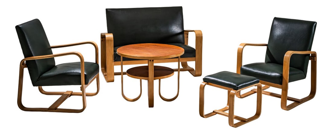 Seating Group by Giuseppe Pagano Pogatschnig, Set of 5: Seating ensemble comprising two armchairs, a two-seater sofa, a stool, and a side table. The pieces are upholstered in dark green faux leather, creating a refined contrast with the light bentwood fram