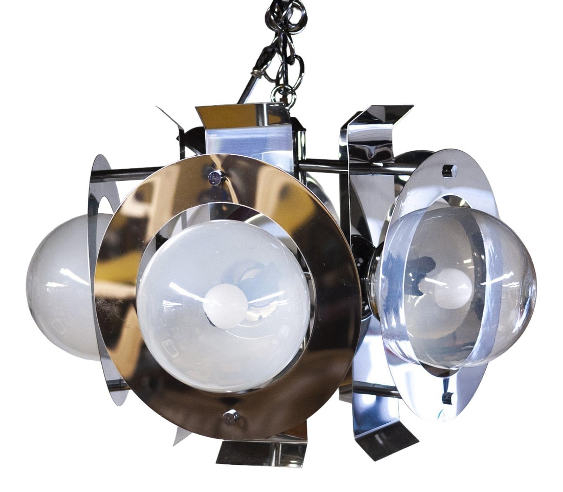 Chrome and Glass Chandelier attributed to Mazzega: A glass and chrome chandelier light from Italian producer Mazzega. The chandelier features five lights. Design Period: 1970 to 1979 Production Period: Unknown Detailed Condition: Good — This