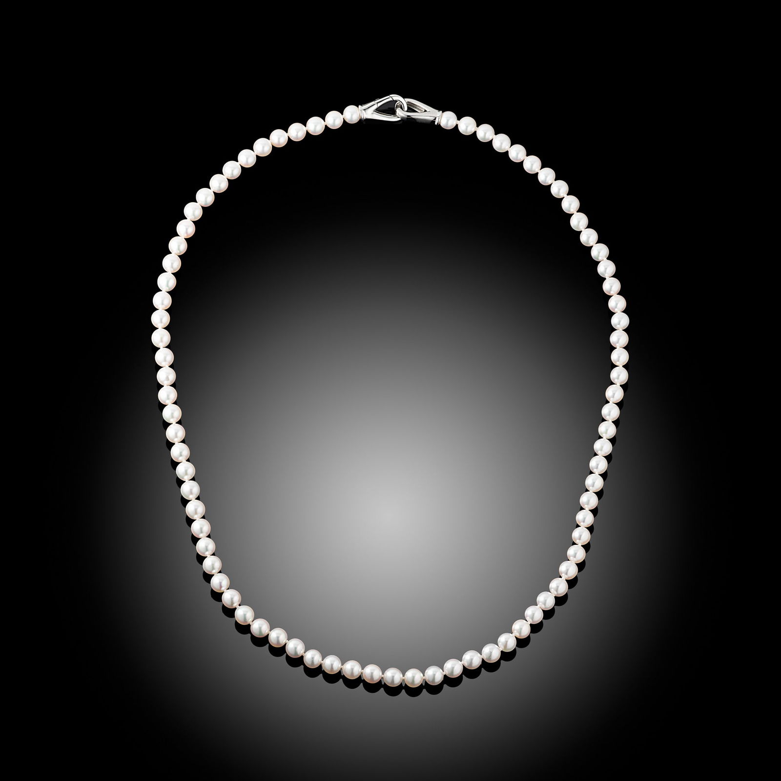 18 Carat AAA Akoya Pearl And Trigger Clasp Necklace: 18 carat yellow gold Indonesian Gold South Sea pearl and diamond set pendant Length 24" Metal Type 18ct White Gold Pearl Type Akoya Pearl Size 6.5-7mm Diamond