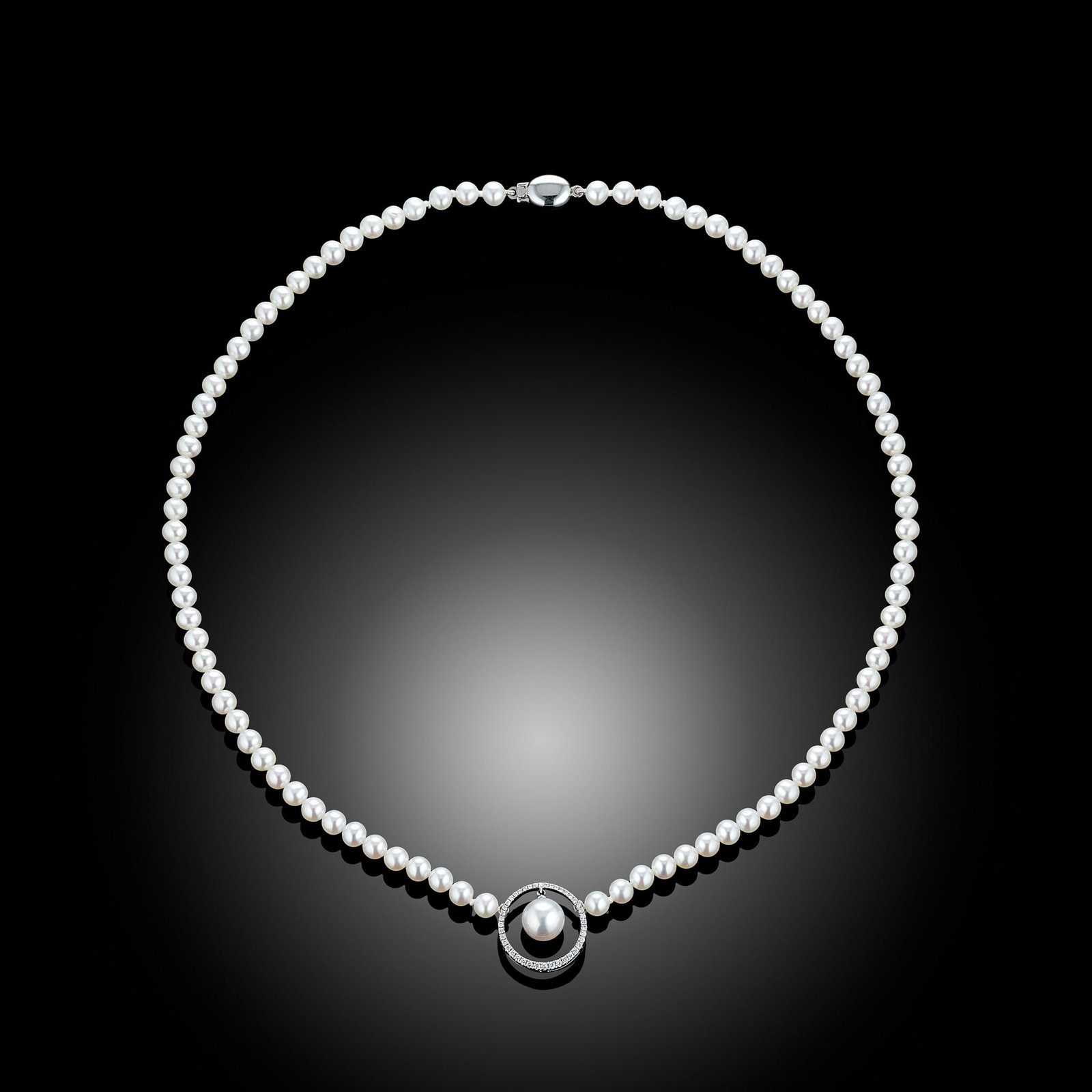 18 Carat Akoya Pearl And Diamond Halo Necklace: 18 carat white gold Akoya pearl and diamond pendant with oval clasp Length 16" Metal Type: 18ct White Gold Pearl Type: Akoya Pearl Size: 5mm & 8mm Diamond Weight: 0.20cts Condition: Unworn Gross W