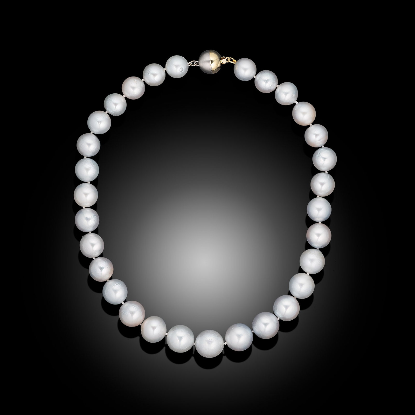 18ct 2-Tone Grey South Sea Pearl Necklace: 18ct 2-tone ball clasp and light grey South Sea graduating pearl necklace Item Length: 17inch Drop Length: N/A Metal Type: 18ct 2-Tone Pearl Type: South Sea Pearl Size: 12-15mm Diamond Weight: N/A