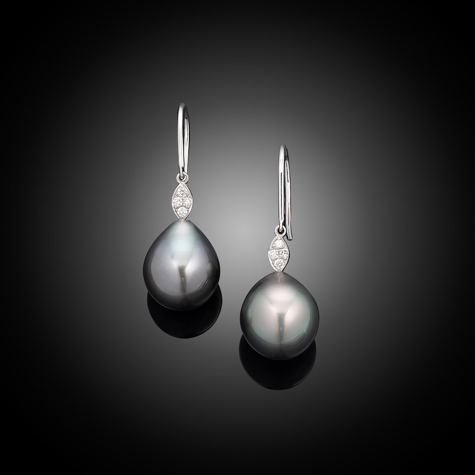 18ct White Gold Tahitian Pearl & Diamond Hook Earrings: 18ct white gold diamond set hook earrings with drop shape Tahitian pearls Item Length: N/A Drop Length: 30mm Metal Type: 18ct White Gold Pearl Type: Tahitian Pearl Size: 10-10.5mm Diamond Weight: 0.08