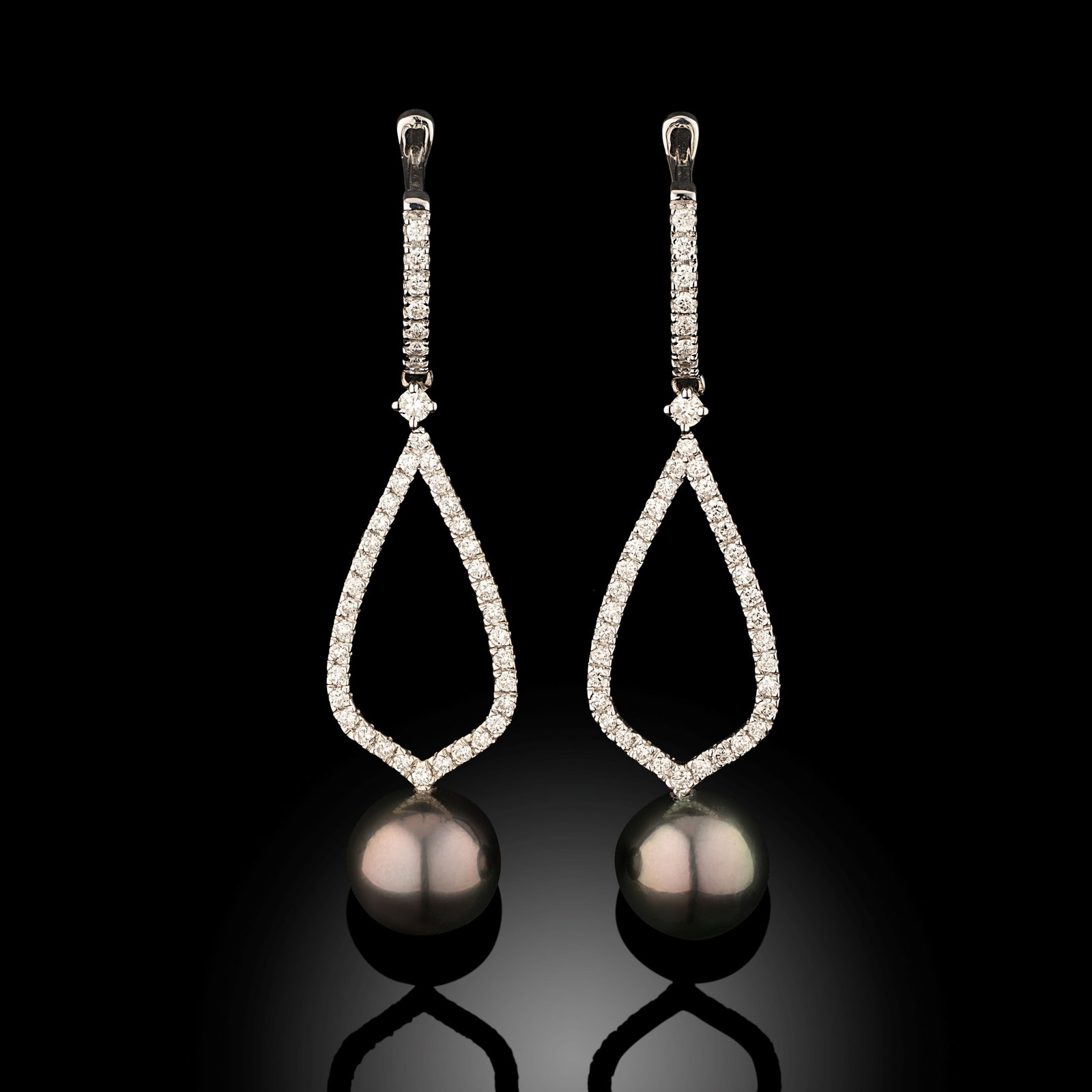 18 Carat Tahitian Pearl And Diamond Hoop Earrings: 18 carat white gold Tahitian pearl and diamond drop earrings with hoop fittings Metal Type: 18ct White Gold Pearl Type: Tahitian Pearl Size: 9-9.5mm Diamond Weight: 0.60cts Condition: Unworn Gross Wei