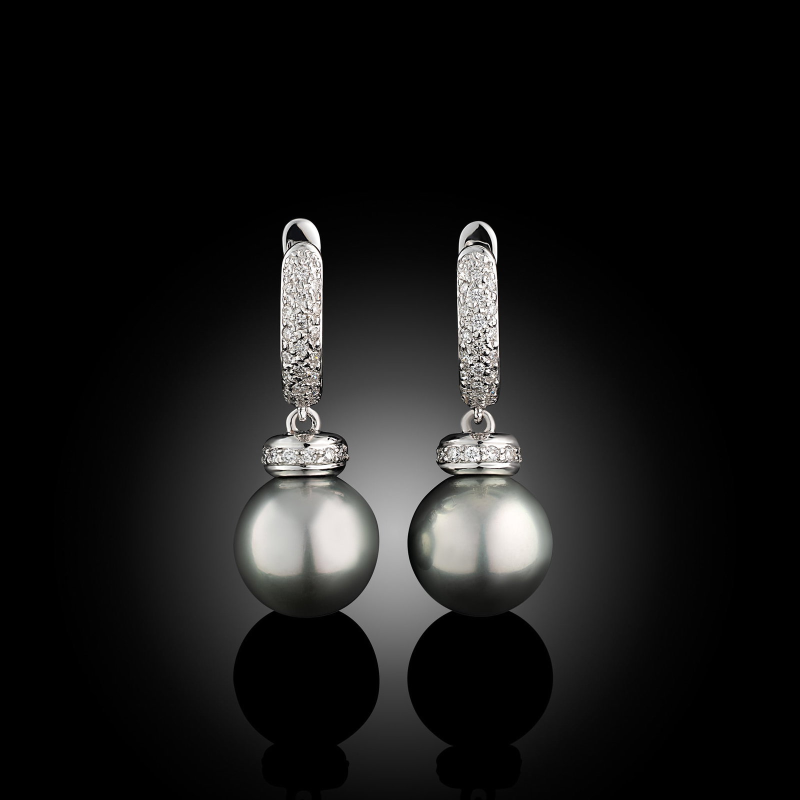 18 Carat Tahitian Pearl And Diamond Hoop Earrings: 18 carat white gold Tahitian pearl and diamond set hoop earrings Metal Type: 18ct White Gold Pearl Type: Tahitian Pearl Size: 10-10.5mm Diamond Weight: 0.40cts Condition: Unworn Gross Weight: 6.2gms M