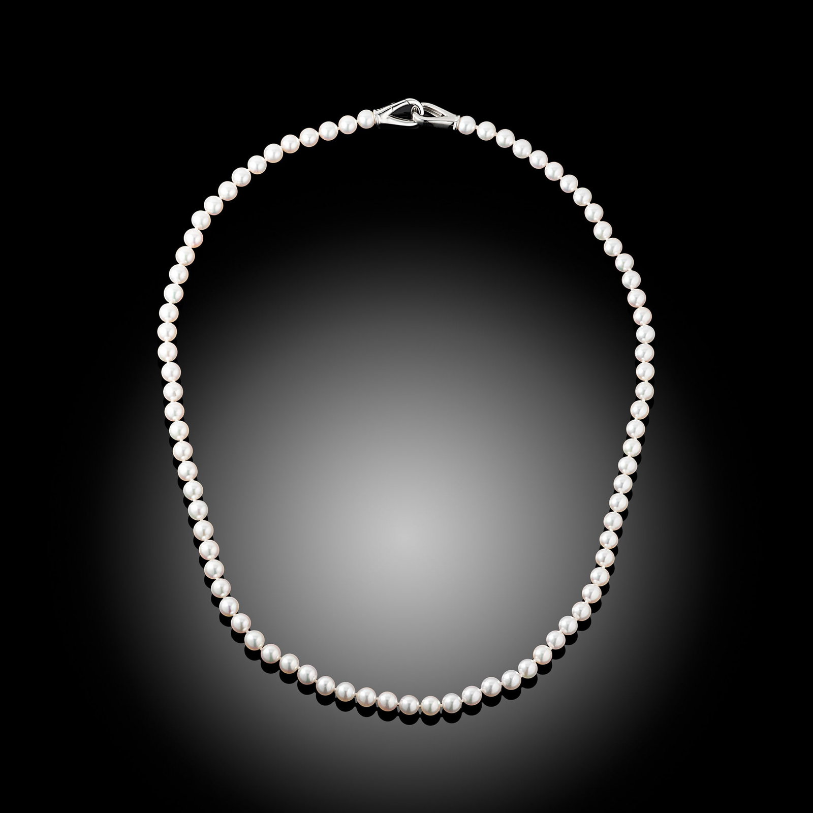 18 Carat AAA Akoya Pearl And Trigger Clasp Necklace: 18 carat white gold Akoya pearl necklace with heavy trigger style clasp Length 24" Metal Type: 18ct White Gold Pearl Type: Akoya Pearl Size: 6.5-7mm Diamond Weight: N/A Condition: Unworn Gross Weight: