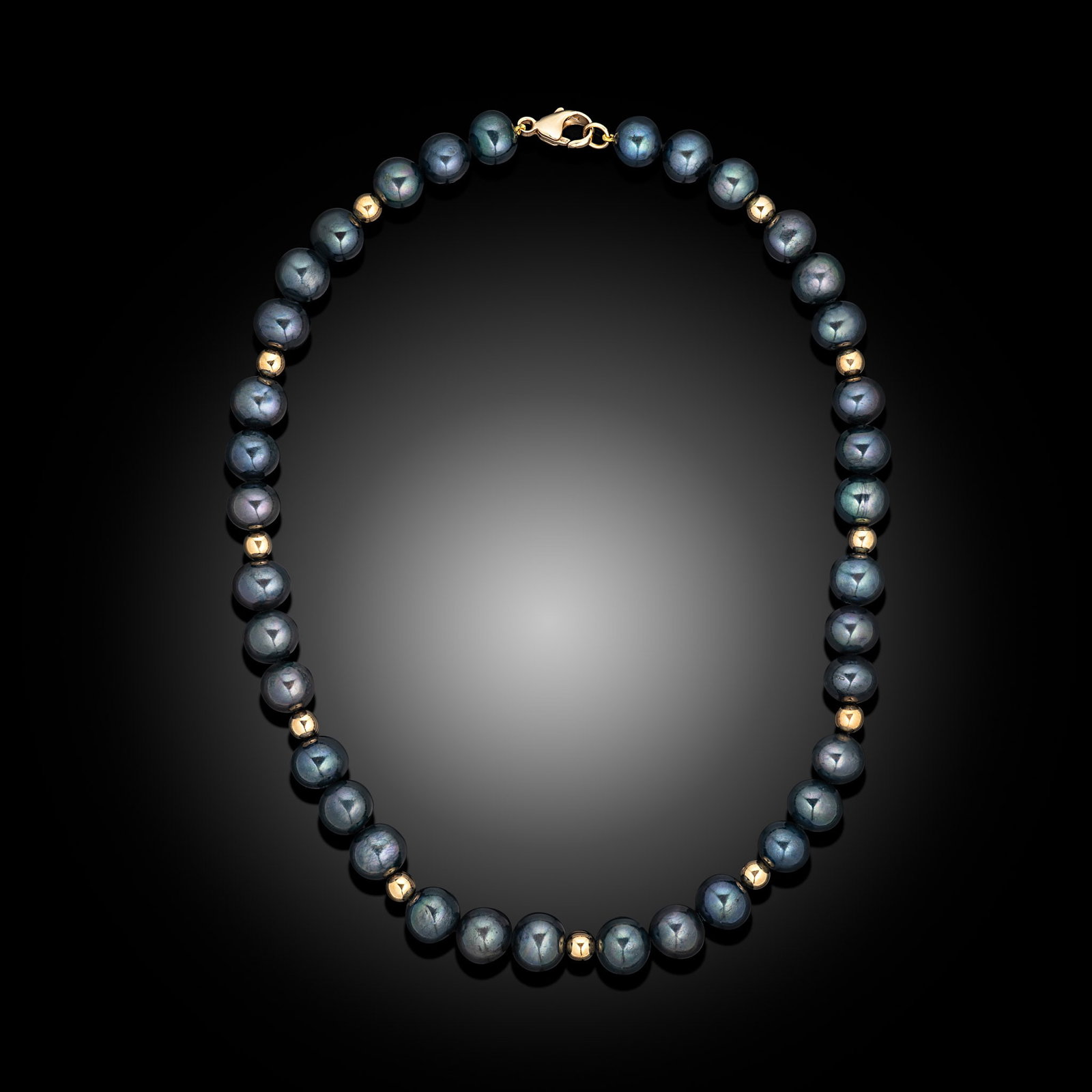 18ct Yellow Gold Black Freshwater Pearl & Bead Necklace: 18ct yellow gold beaded necklace with black dyed Freshwater pearls and trigger clasp Item Length: 18inch Drop Length: N/A Metal Type: 18ct Yellow Gold Pearl Type: Freshwater Pearl Size: 11-12mm Diamon