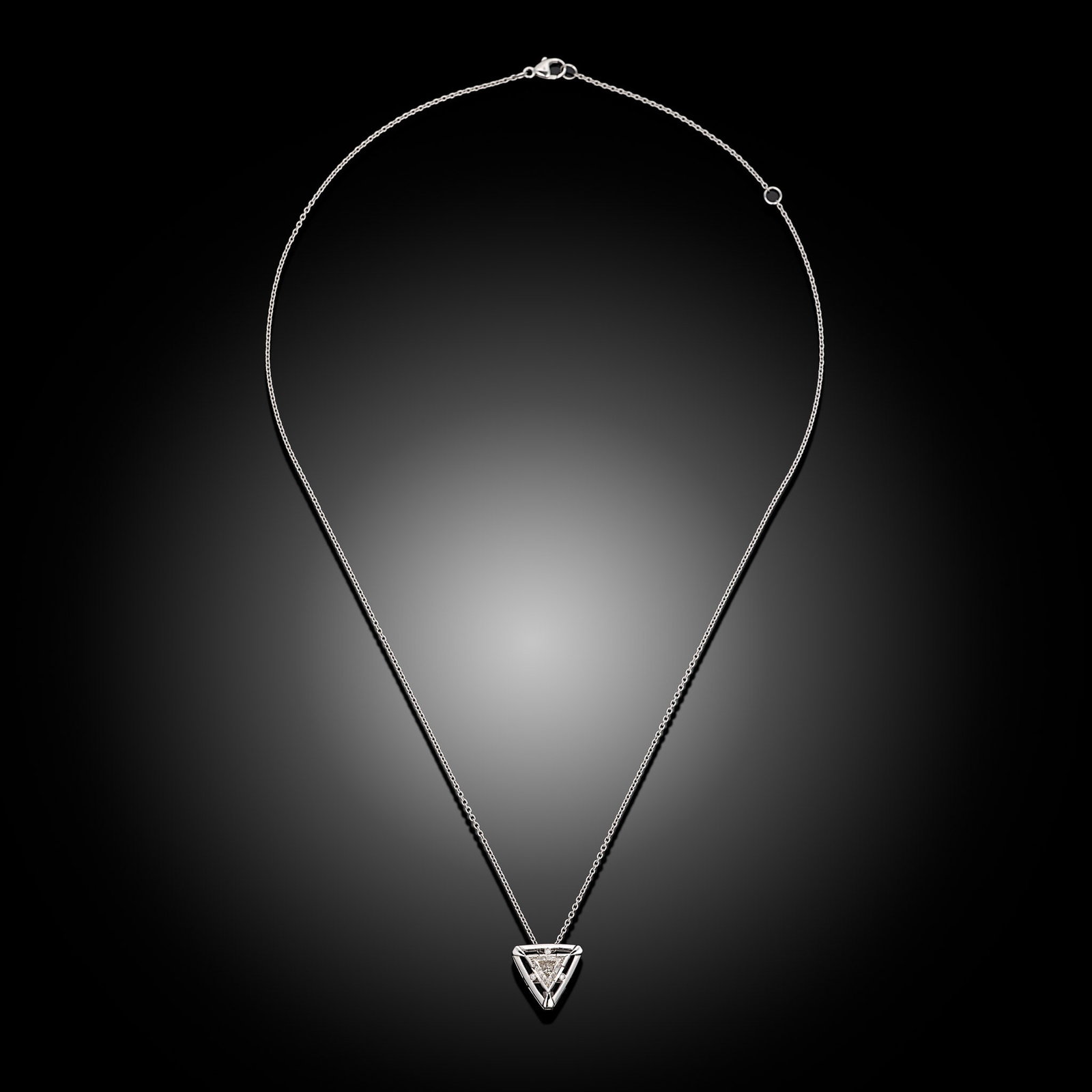 18ct Wite Gold Trilliant Cut Diamond Pendant: 18ct white gold triangular pendant with trilliant cut diamond on trace chain Item Length: 8inch Drop Length: 12mm Metal Type: 18ct White Gold Pearl Type: N/A Pearl Size: N/A Diamond Weight: 0.70cts