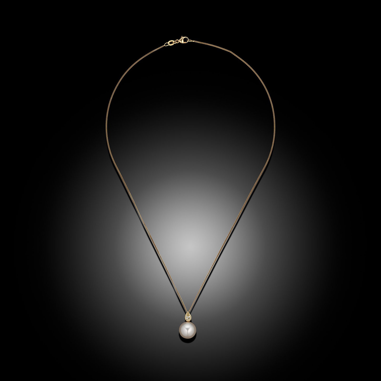 18ct Yellow Gold South Sea Pearl & Pear Cut Diamond Pendant: 18ct white gold round South Sea pearl and fancy colour pear cut diamond pendant in bezel setting with curb chain Item Length: 18inch Drop Length: 18mm Metal Type: 18ct Yellow Gold Pearl Type: South Se