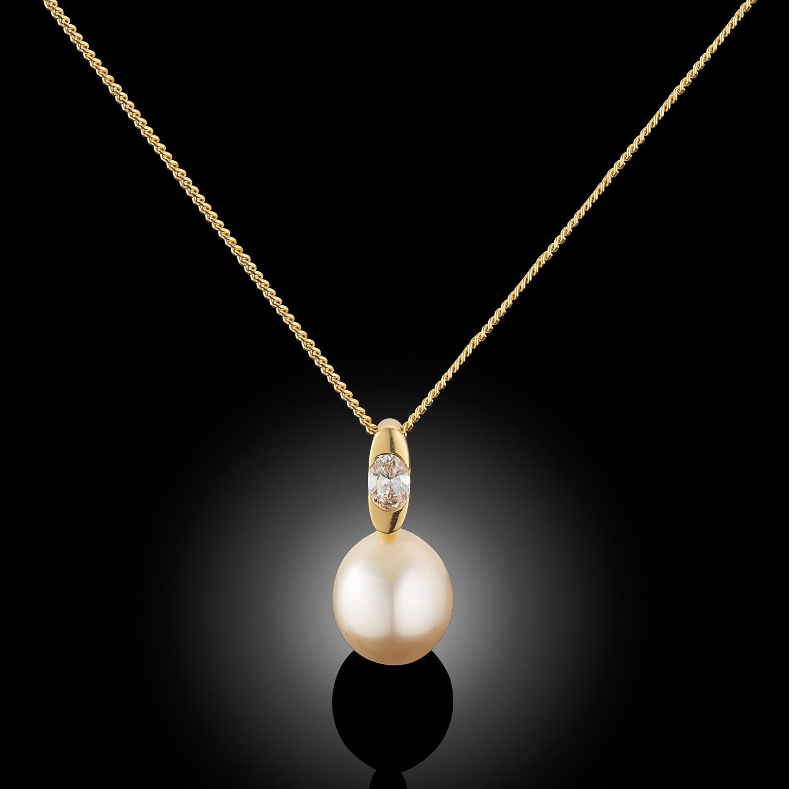 18 Carat Gold South Sea Pearl And Diamond Pendant Necklace: 18 carat yellow gold Indonesian Gold South Sea pearl and diamond set pendant Length 16" Metal Type: 18ct Yellow Gold Pearl Type: Gold South Sea Pearl Size: 10.5-11mm Diamond Weight: 0.25cts Condition: