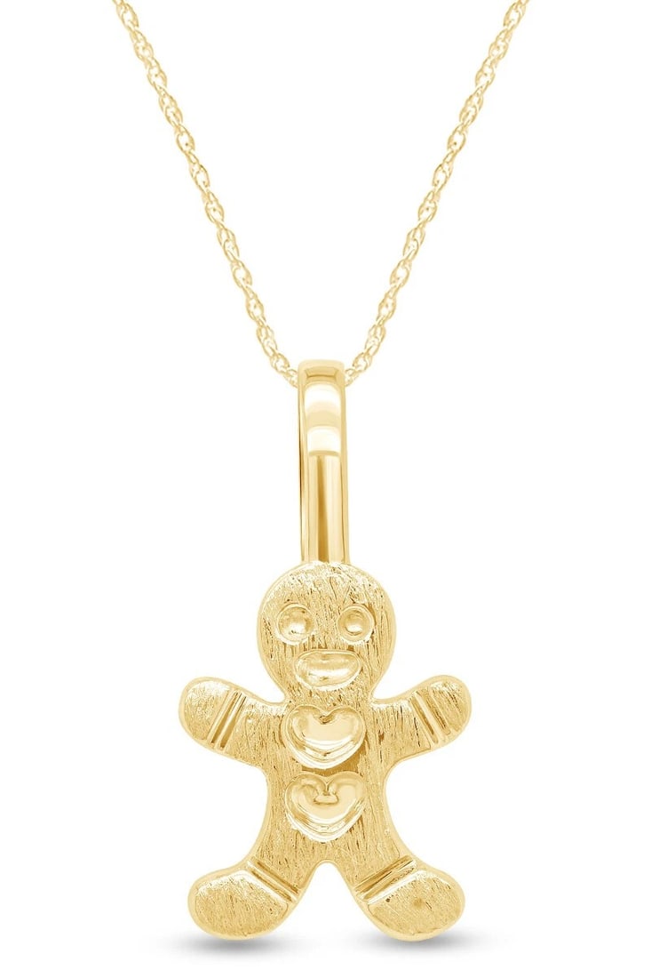 GOLD-TONE GINGERBREAD FIGURE PENDANT NECKLACE: GOLD-TONE GINGERBREAD FIGURE PENDANT NECKLACE Description: A playful gingerbread-person pendant in polished gold-tone metal, modeled with raised facial and costume details and suspended from a fine