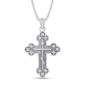 WHITE-METAL COLORLESS STONE CROSS PENDANT NECKLACE: WHITE-METAL COLORLESS STONE CROSS PENDANT NECKLACE Description: An ornate white-metal cross pendant with trefoil-like terminals and a line of small colorless stones set along the face.