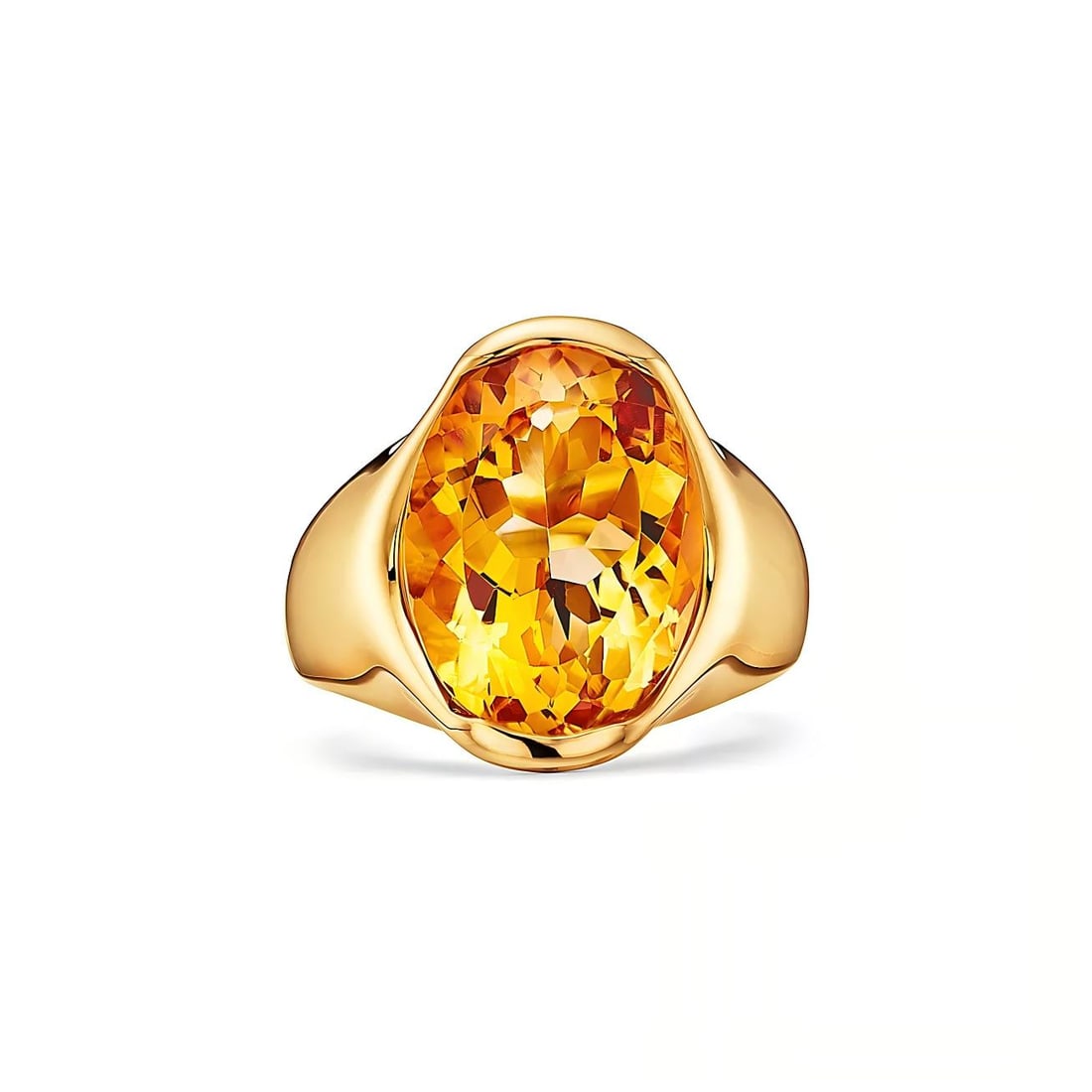 OVAL-CUT CITRINE SET IN YELLOW GOLD RING: OVAL-CUT CITRINE SET IN YELLOW GOLD RING Description: The lot consists of a bold statement ring crafted in yellow gold and centered with a large oval-cut citrine gemstone; the faceted stone displays a