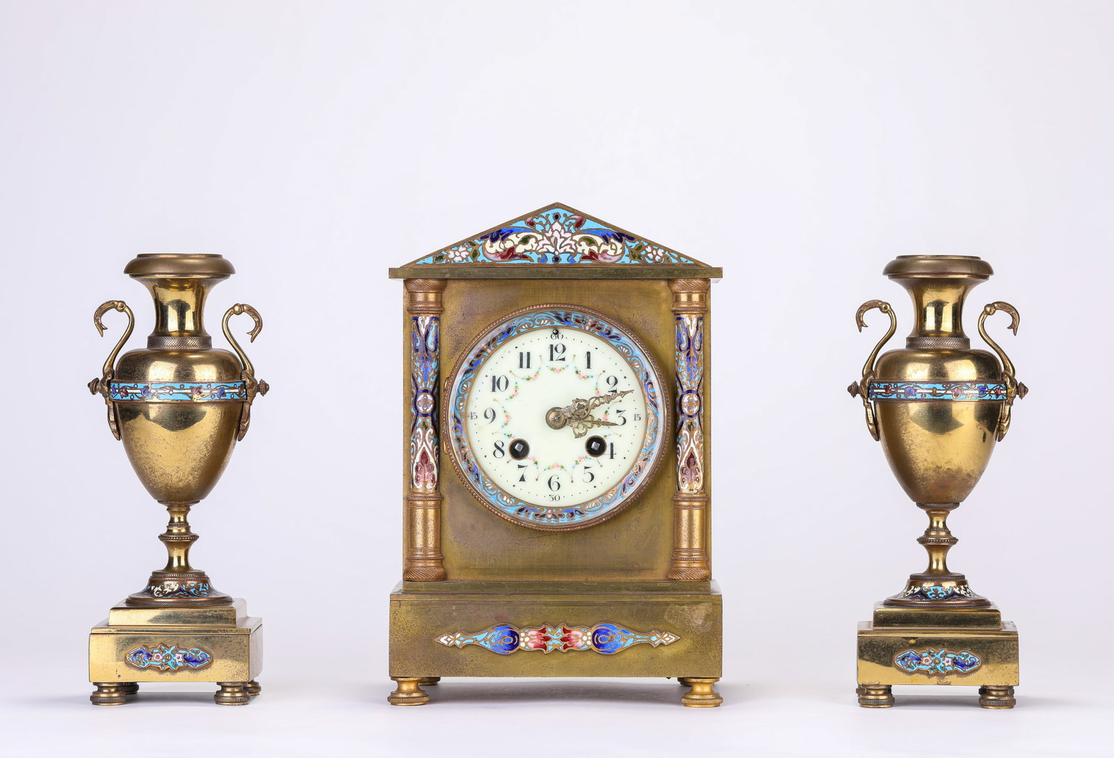 A FRENCH GILT-BRONZE AND ENAMEL MANTEL CLOCK: A FRENCH GILT-BRONZE AND ENAMEL MANTEL CLOCK Description: Dimensions: Weight: 5361 g. Length: 16.4 cm x Width: 11.8 cm x Height: 24.8 cm. Weight: 1386 g. Length: 8 cm x Width: 7 cm x Height: 22.4 cm.