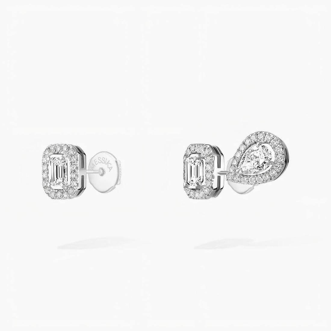 0.10 CARAT 18K WHITE GOLD SET WITH DIAMONDS STUD EARRINGS: 0.10 CARAT 18K WHITE GOLD SET WITH DIAMONDS STUD EARRINGS Description: The translucent and brilliant diamonds complement the gleaming white gold, emitting a captivating and enchanting light. On the
