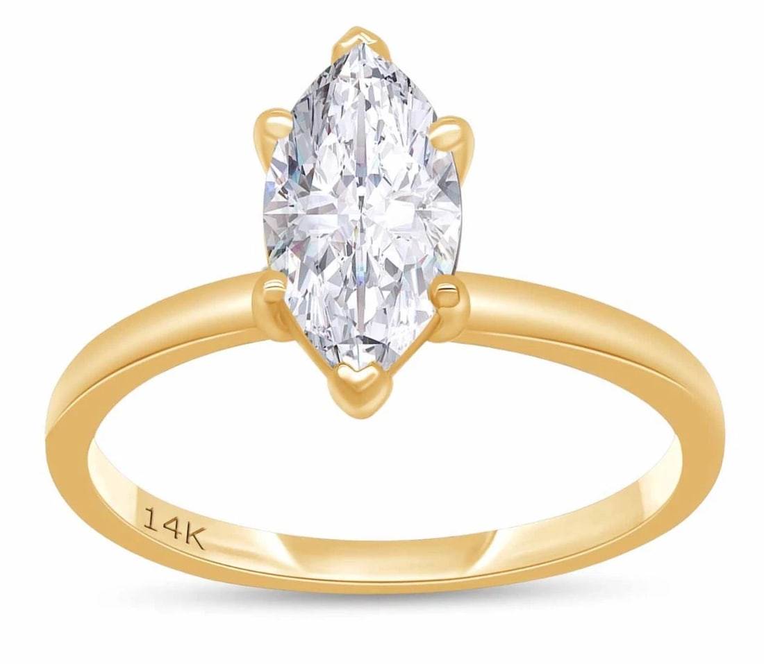 14K GOLD MARQUISE-CUT COLORLESS STONE SOLITAIRE RING: 14K GOLD MARQUISE-CUT COLORLESS STONE SOLITAIRE RING Description: A refined yellow-gold ring centered by a marquise-cut colorless stone in a raised prong setting. A visible 14K mark appears on the inn