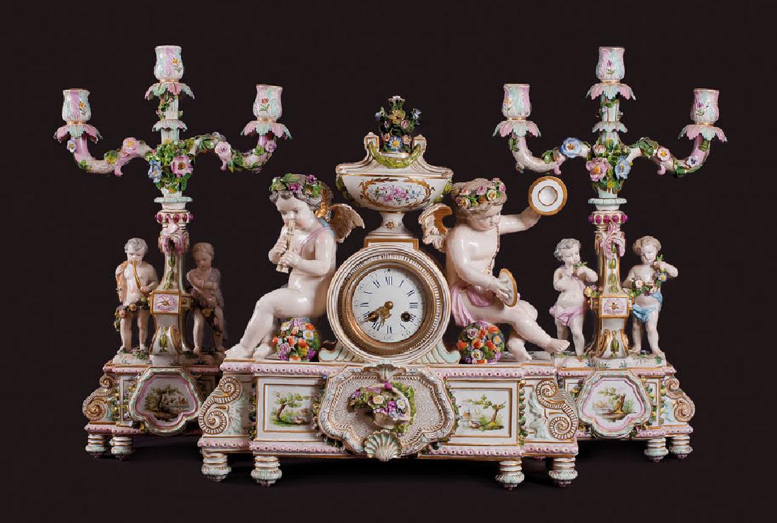 Fireplace clock with 2 candlesticks, Meissen, Germany: 18/19th century. Gemany, Meissen porcelain factory. Porcelain, metal, glass, painting. Size of the clock 45x15x47 cm, size of the candlesticks 21x11x53 cm