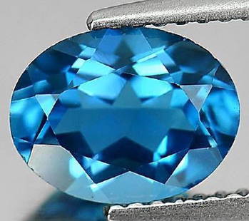 Natural London Blue Topaz 24.23 carats- Flawless: Natural London Blue Topaz 24.23 carats- Flawless/VVS...size - 20 x 15 x 9 mm; 100% natural earth mined...top luster fire; Irradiation treatment; Top Color; Blue Topaz - reflects the energy of the