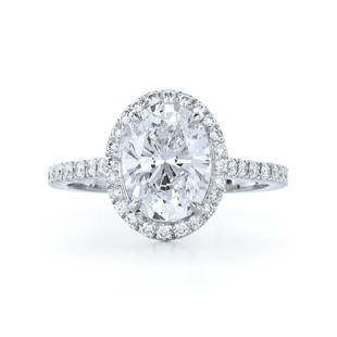 Natural Diamond Ring 1.10 cts - EGL: 14k white gold...size 6.75; Total gross weight 2.270 grams; center stone oval shape....0.71 cts...I/I-J; side stones....0.39 cts; EGL certified
