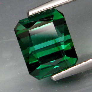 Natural Top Bluish Green Tourmaline 3.26 cts: TourmalineSHAPE :Emerald CutWEIGHT :3.26 Ct.SIZE :8.6 X 7 X 6 Mm.QUANTITY :1 PieceCOLOR :Top Blue GreenCLARITY :SiLUSTER :SuperiorORIGIN :MozambiqueTREATMENT :NoneHARDNESS :7-7.5