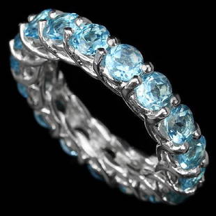 Natural Swiss Blue Topaz Eternity Band: GENUINE AAA SWISS BLUE TOPAZ ROUND FACET 925 SILVER RING 14K WHITE GOLD COATING..........STONE SHAPEROUND PORTUGUESE CUTSTONE DIMENSION4 MM.; Size - 6;MAIN STONE WEIGHT5.5 CARAT;COLOR-SWISS