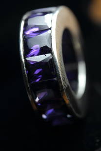 Stunning Amethyst Eternity Band 45.25 Carats: Stunning Amethyst Eternity Band 45.25 Carats.......Heavy...stylish eternity band.....925 Sterling Silver....Over 7 grams.....Eternity Band Size 6.75 & 7....(Note - Please advise if you have any ring