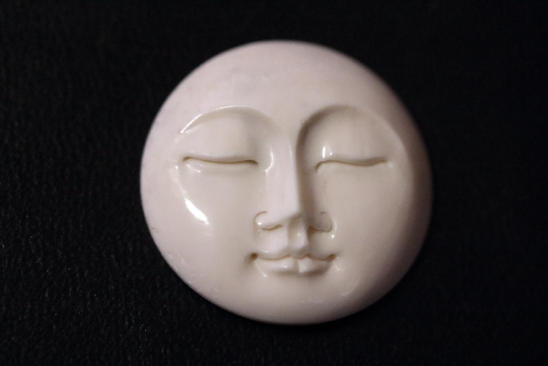 Hand Carved Peaceful Moon Pendant: Hand Carved Peaceful Moon Pendant.........symbol of Peace, Harmony and Love.........hole in the back for necklace.....25mm