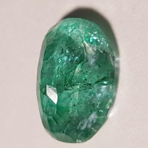 BEAUTIFUL CERTIFIED 5.95 CT EMERALD SOLITARE: BEAUTIFUL CERTIFIED 5.95 CT EMERALD SOLITARE. THIS EMERALD DISPLAYS INTENSE COLOR SATRATION WITH A HIGH LUSTER AND A STRONG VIVID TONE. VERY TRANSPARENT WITH A FINE OVAL CUT. MEASURES 13.37 x 9.51 x 5