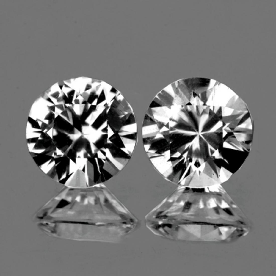 Natural Diamond Cut White Zircon Pair 6.50 MM - FL: Natural White Zircon ; SHAPE : Round (Diamond Cut) SIZE ( L x W x D ) : 6.50 mm; QUANTITY : 2 pieces ( Perfectly Matched Pair ) COLOR : Best White (Colorless) CLARITY : Flawless-VVS1 AAA Grade ORIGIN 
