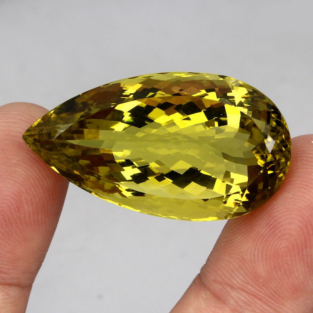 Ntaural Top Yellow Lemon Quartz 73.60 Cts - Untreated: Main Stone Shape:Pear CutMetal:noneMain Stone Color:Top Lemon YellowBase Metal:Fine Silver, 925 parts per 1000Main Stone Treatment:UnheatedMetal Purity:925 parts per 1000;;Origin:BrazilClarity/Grade:I