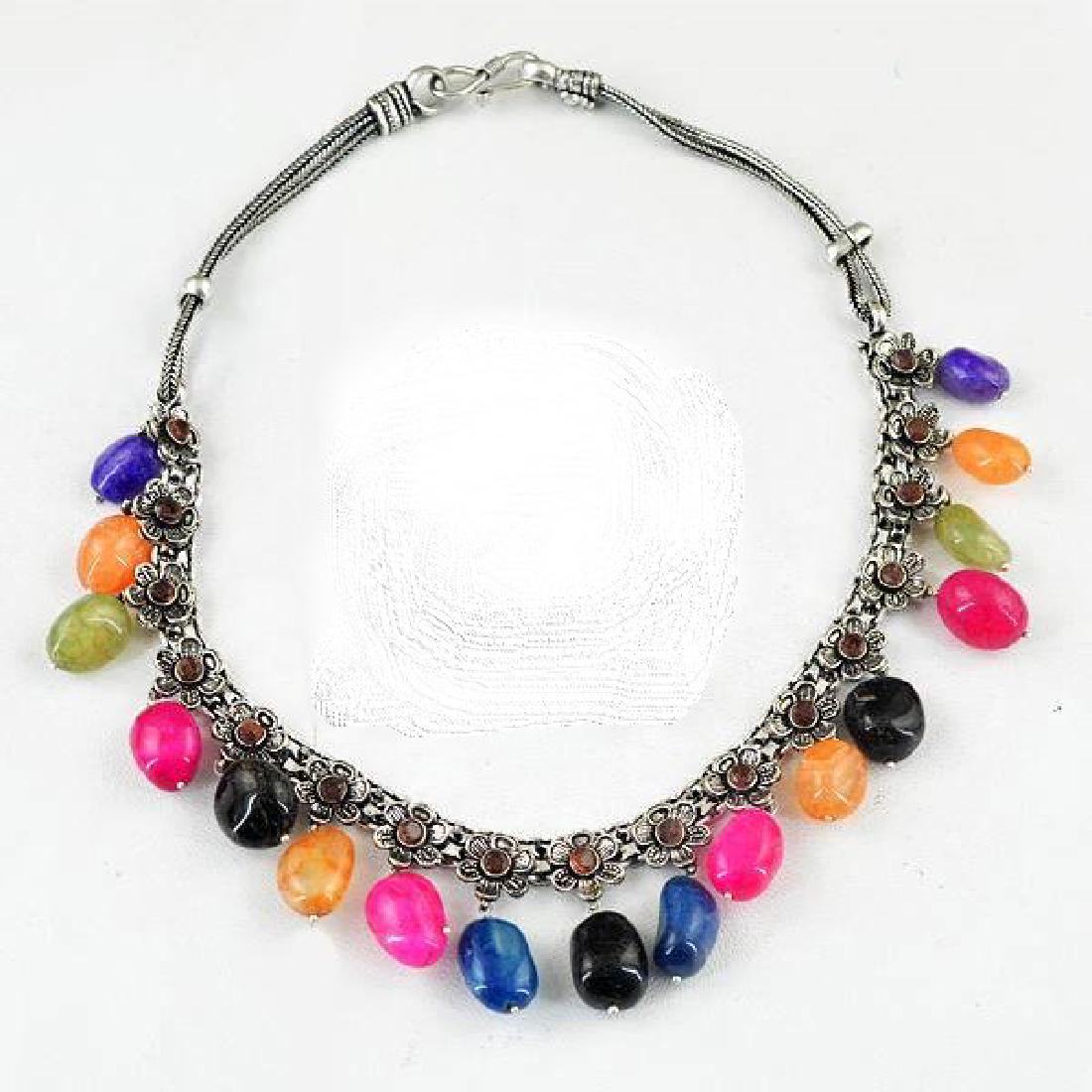 BEAUTIFUL CERTIFIED MUTI COLOR ONYX NECKLACE: BEAUTIFUL CERTIFIED MUTI COLOR ONYX NECKLACE. 17 ONYX STONES COMPLIMENTED BY AMETHYST ACCENTS.MOUNTED IN .925 TIBET SILVEER OVERYLAY.APPROX 18" LONG WEIGHING 92 GRAMS OR 540 CTTW. PLEASE SEE CERTIFICA