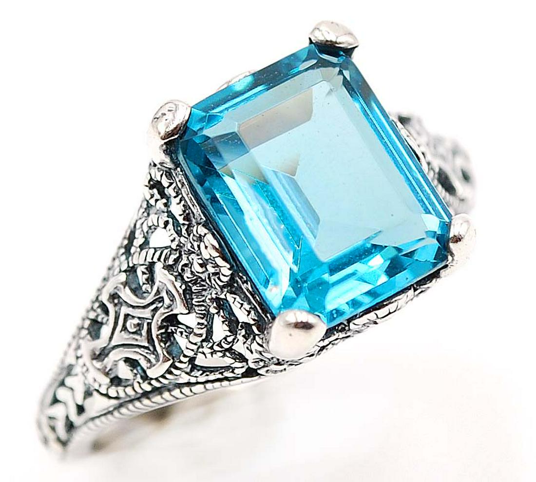 LOVELY NATURAL 4.5 CT SWISS TOPAZ RING (1 of 2)