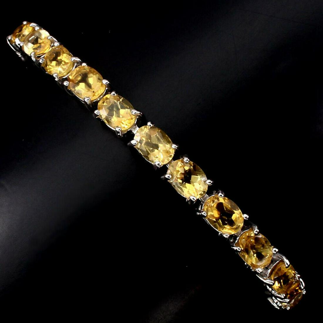 Natural Oval Yellow Citrine 7x5 MM - 67.93 Ct Bracelet: 925 STERLING SILVER;PLATE...14K WHITE GOLD;LENGTH (INCHES)-7.5;MAIN STONECITRINE;TOTAL WEIGHT-67.93 CT (TOTAL WEIGHT OF SILVER + STONE)DIMENSION* STONE 7.0 X 5.0 MM. * FACE BRACELET 175.0 X 6.0 MM.;MA